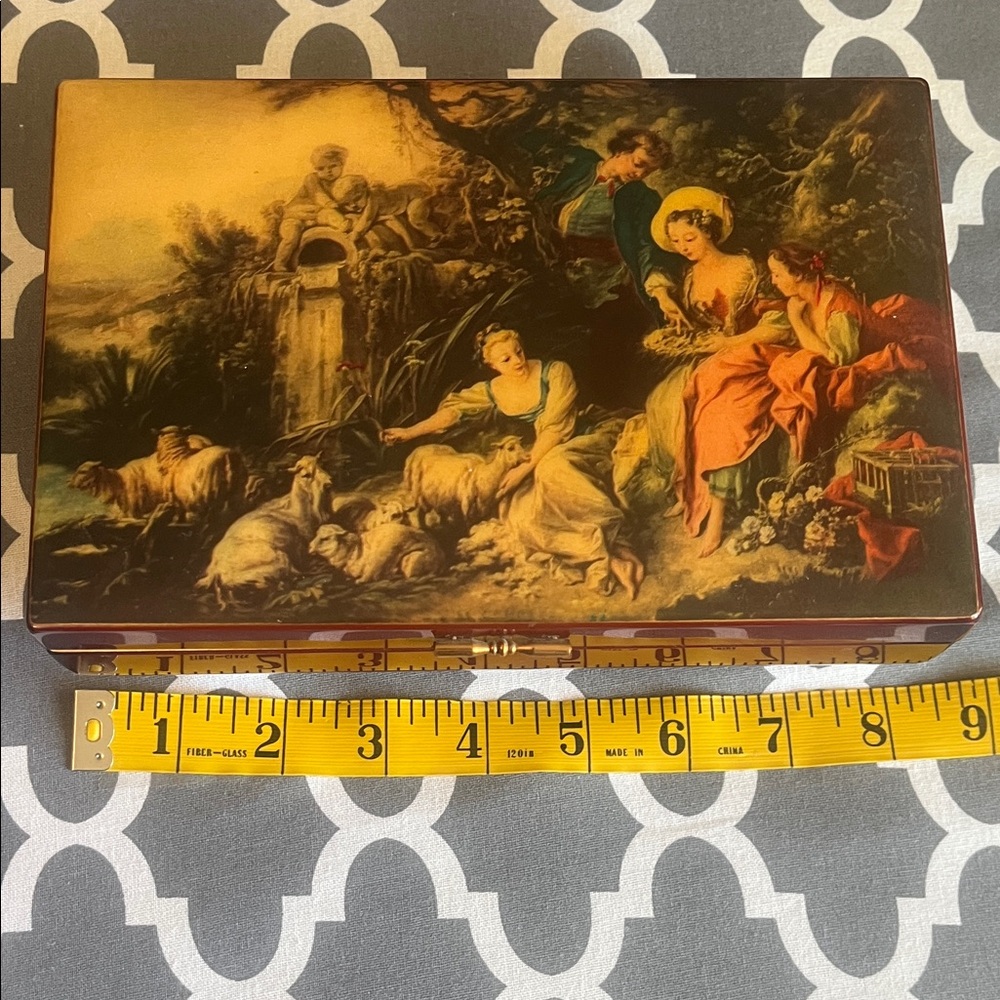 Refuge Musical Jewelry Box with Red and Gold Accents.